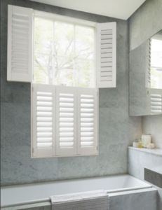 grey bathroom with tier on tier shutters
