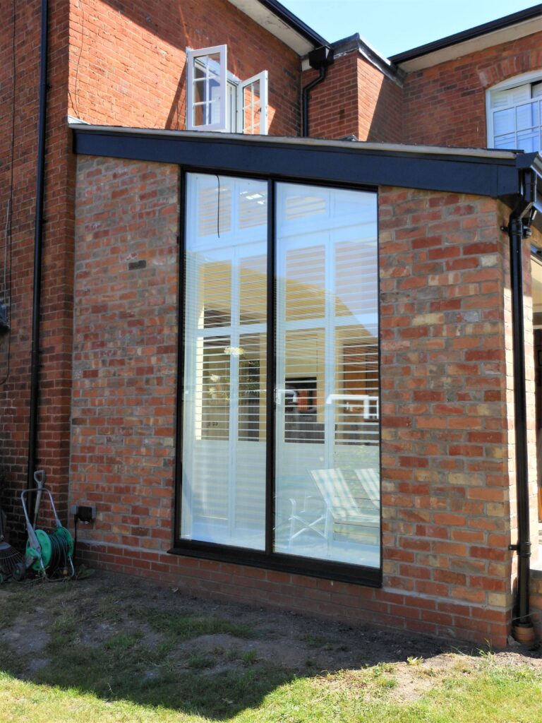 Bespoke shape shutters on a triangle shaped window