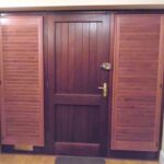 Brown front door shutters closed