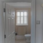 White bathroom shutter