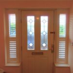 Hallway front door with small shutters