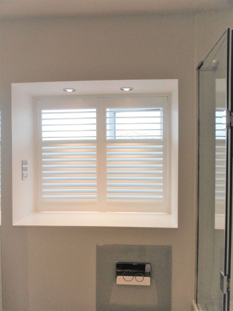 Modern shower room with white shutter