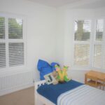 children's bedroom with white shutters