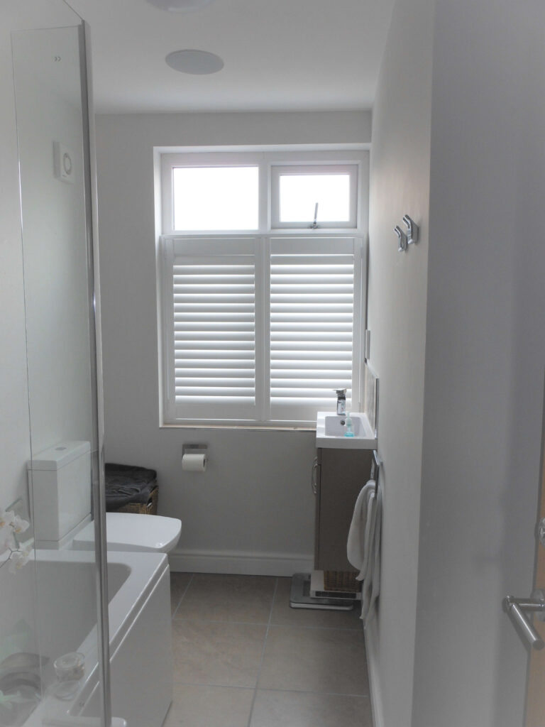 white bathroom shutters