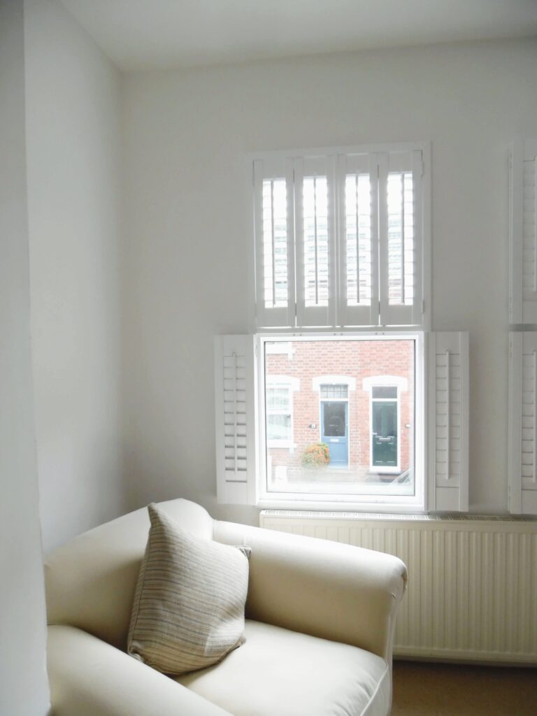 White lounge shutters half open half closed