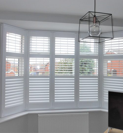 Lounge window with white shutters open