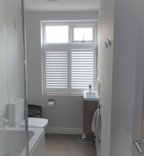 white bathroom shutters