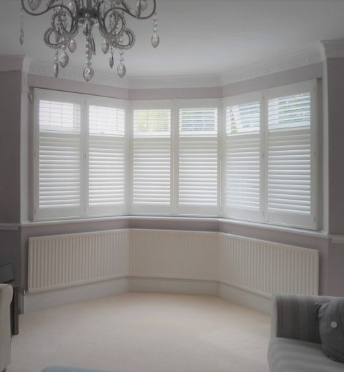 large bay window in lounge with shutters
