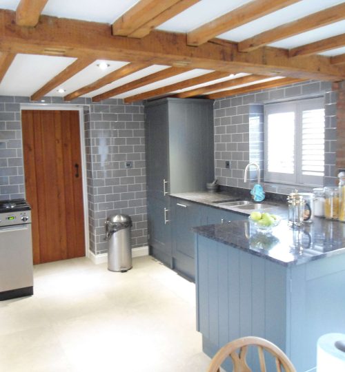 Wooden beamed kitchen with shutter