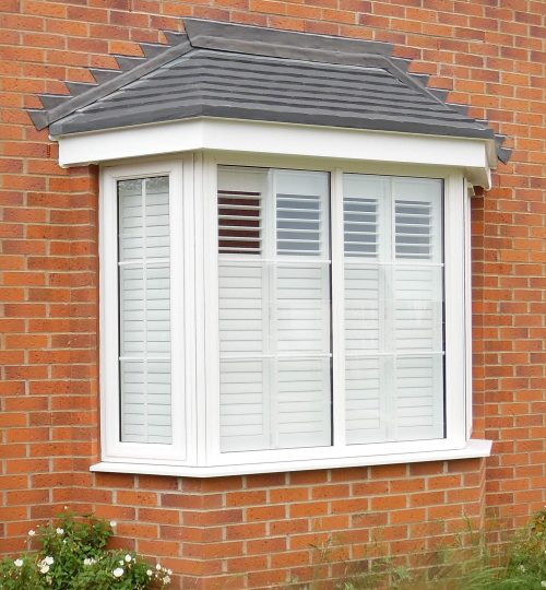 Outside view of a bay window with shutters