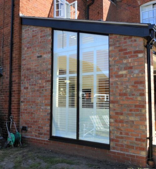 Bespoke shape shutters on a triangle shaped window