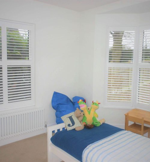 children's bedroom with white shutters