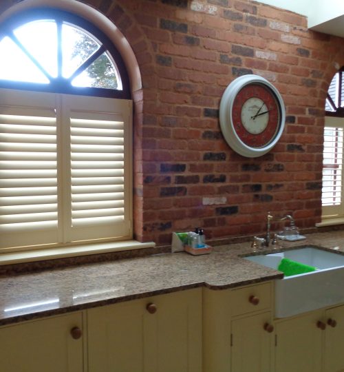 cafe shutters on a round window