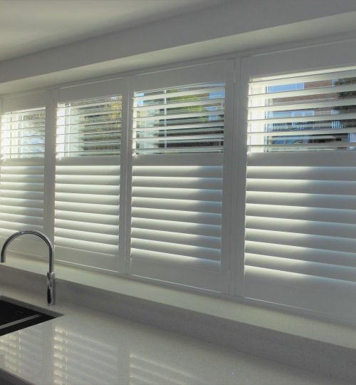 Long kitchen window with shutters