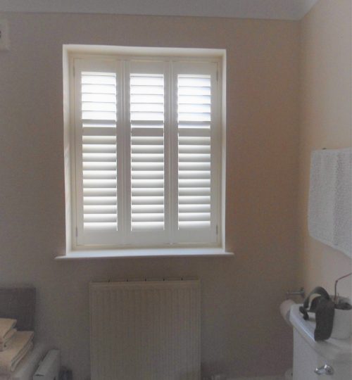 White bathroom shutter closed