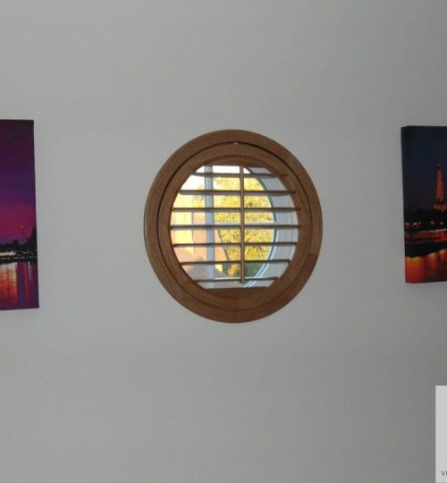 Round window with oak shutter