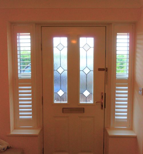 Hallway front door with small shutters