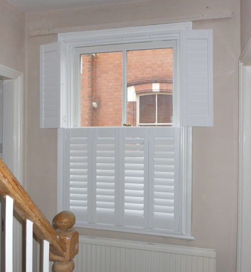 white tier on tier shutters in a hallway