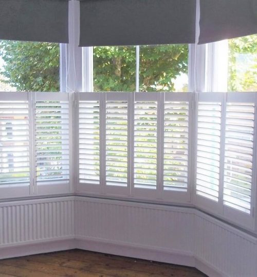 white bay window cafe shutters